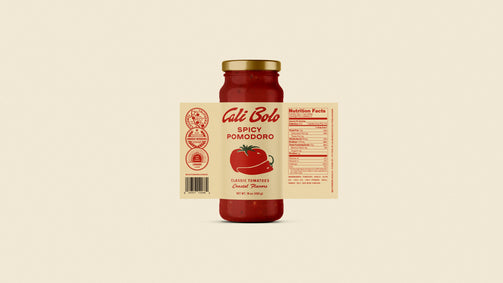 Jar of Cali Bolo Pomodoro sauce on a beige background
